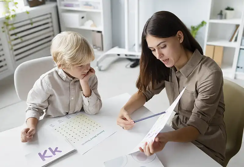 “Psychologist observing a child’s play and attention during a neurodevelopmental assessment for ASD and ADHD”